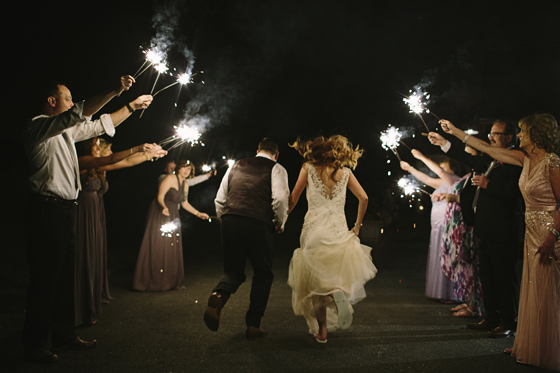 Bride and Groom run through sparklers