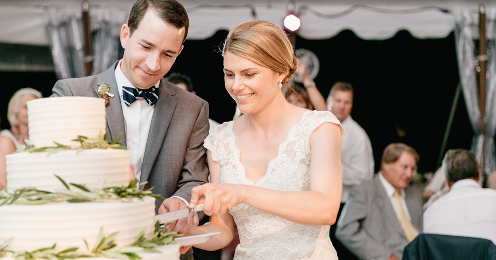 bride and groom cutting their cake