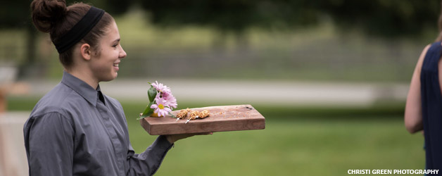 Event Staff passing food at an event